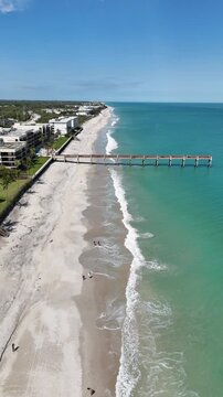 Aerial view of Vero Beach and pier on a sunny day in Vero Beach in Indian River County, Florida.