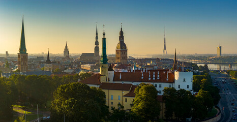 Obraz premium Aerial panoramic view of Old Riga during sunrise in summer, Riga Castle in foreground