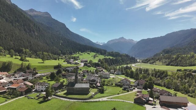 Aerial view of Zillis-Reischen alpine village in green valley, Graub&uuml;nden, Switzerland