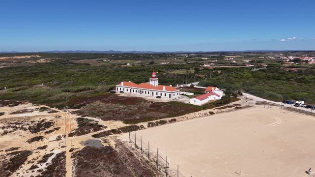 Cabo sard&atilde;o lighthouse orbiting aerial view in alentejo portugal