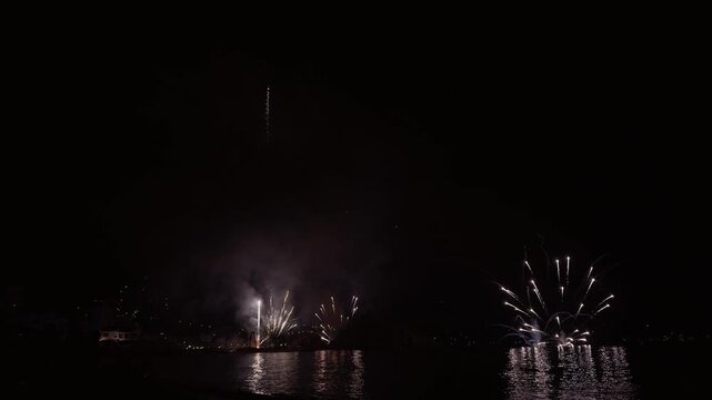 Fireworks bursting over the seafront in Blanes, Spain
