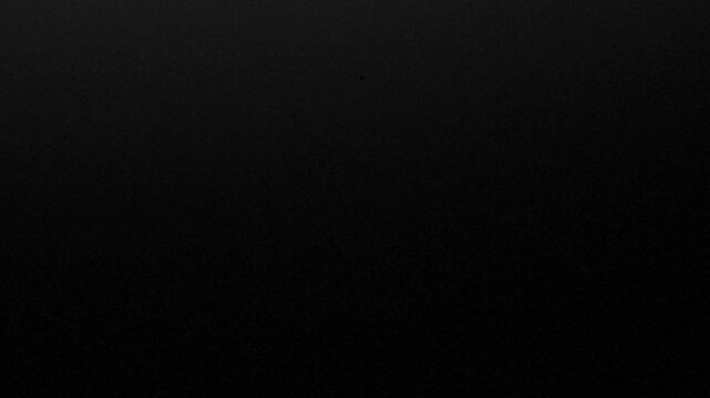 Vintage old film overlay with bright vertical projector scratches, jitter, and flickering light on dark background