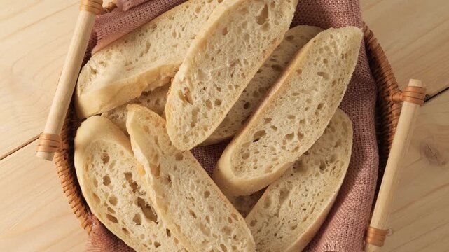 Freshly sliced bread rotating in a basket
