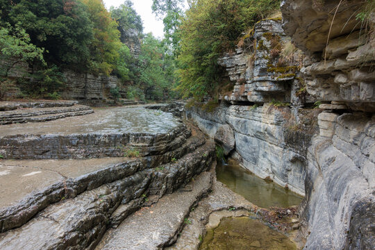 Amazing rocky formations with natural pools or Kolympithres, where the river flows, in Papiggo, Pindos mountain, Greece