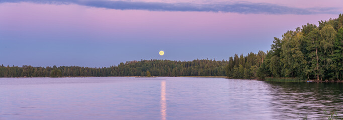 Hallangen lake at sunset with moonrise. Kalmar region. Sweden © Pawel Pajor