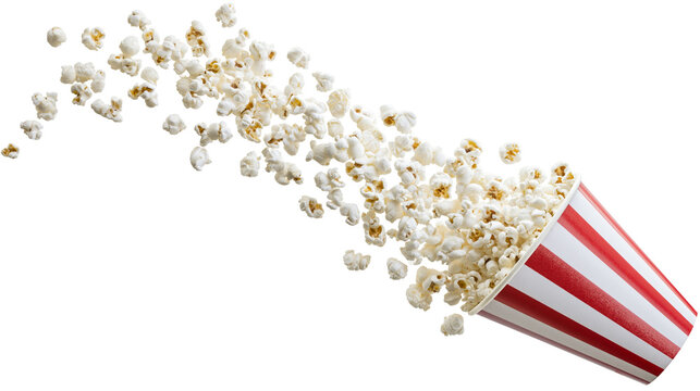 Isolated golden kernels of fluffy popcorn spilling from a classic red and white striped bucket