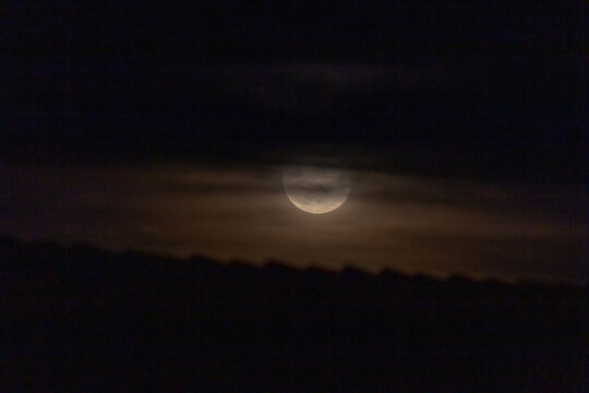  Full moon in the night sky with clouds