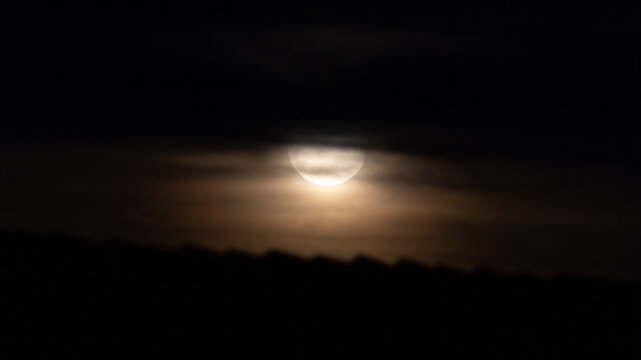 Full moon in the night sky with clouds