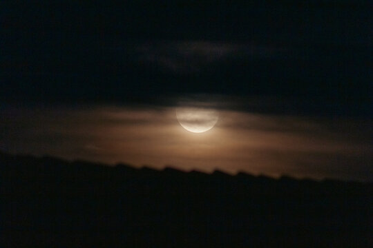  Full moon in the night sky with clouds