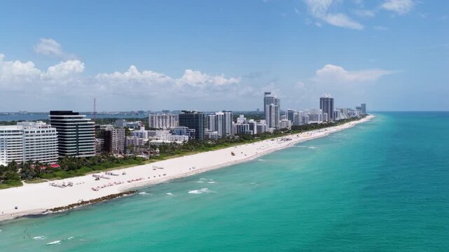 Miami skyscrapers above the coastline. Miamis coastal landscape from above. Aerial view of Miami beach and ocean.