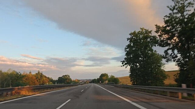 Driving on the highway from Prague to Plzen beneath an evening sky