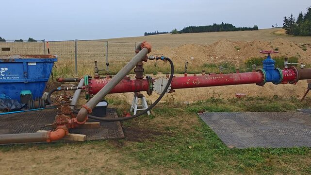 New gas pipeline undergoing leakage testing with valves and pressure equipment