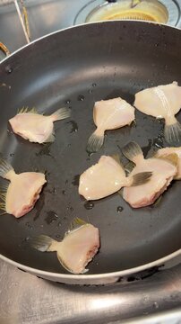 Arranging Filefish Pieces in a Pot Before Simmering, Izakaya Japan, Vertical 4K