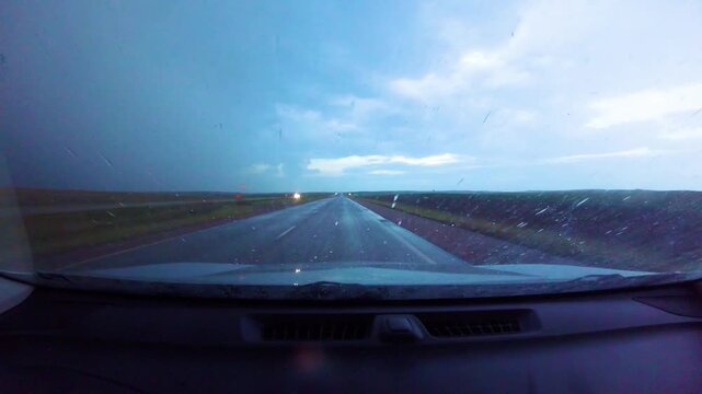 Driving west on Interstate 90 through thunderstorm in South Dakota