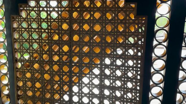 Intricate woven rattan patterns showcase natural texture and light design