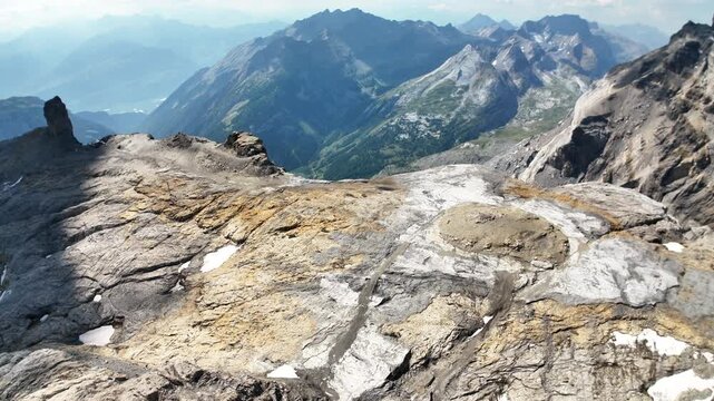 Scenic footage of the Glacier 3000 alpine landscape in Switzerland, featuring expansive glaciers, snow-covered mountains and dramatic high-altitude scenery in the Swiss Alps.