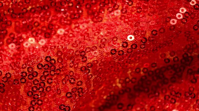 red shimmering surface. Christmas background.New Year design.shimmering red sequin fabric for Christmas,New Year events