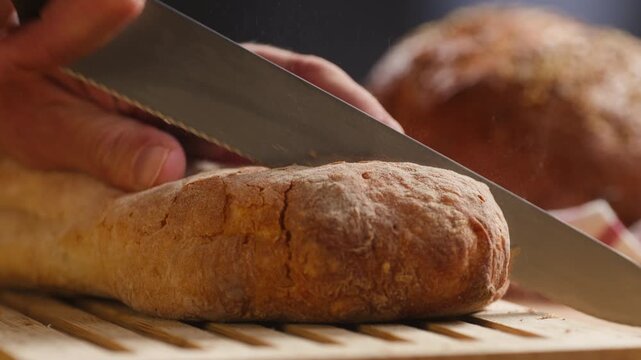 Baguette Bread torn apart by hand, fresh baguette crumb close-up macro shot showing soft airy texture