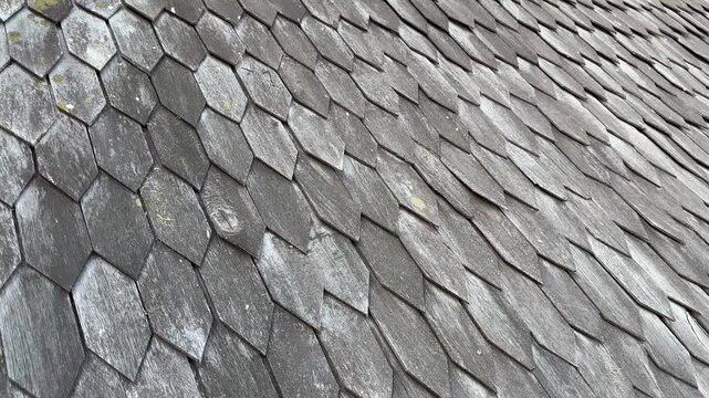Weathered wooden shingles showing the detailed texture of a traditional ironwood roof