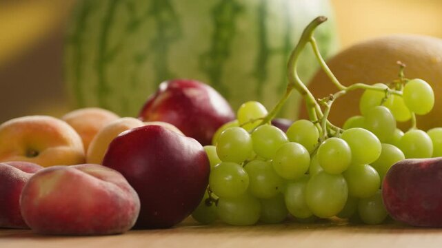 Watermelon, Grape green grapes with peaches and melon, fresh fruit assortment close-up macro shot