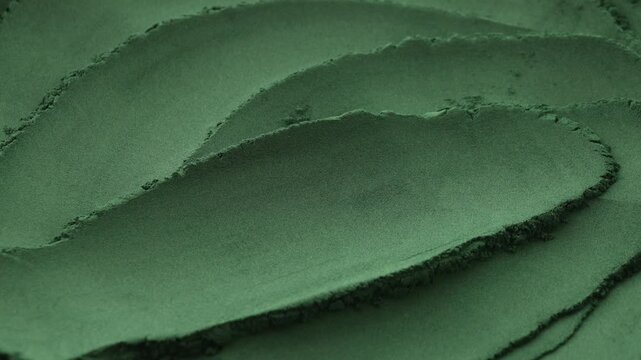 Closeup view of green spirulina powder, spinning