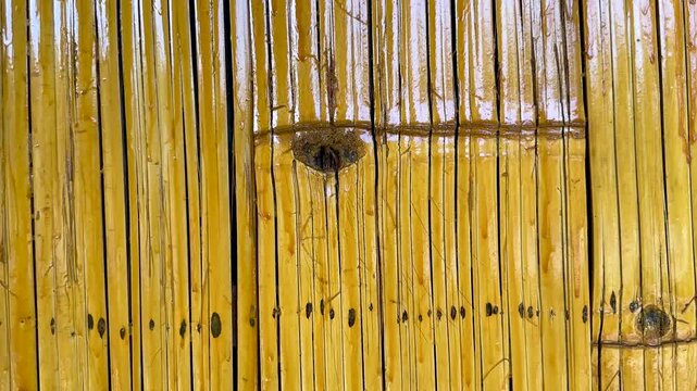 Close up view of polished bamboo panels arranged to form a decorative interior wall structure
