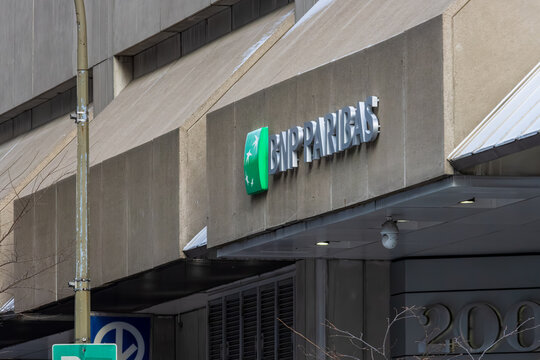 Canada, Montreal, 22 December 2025 : BNP Paribas building facade with parking sign and entrance