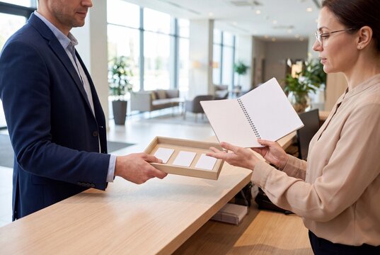 Hotel staff completing front desk shift handover