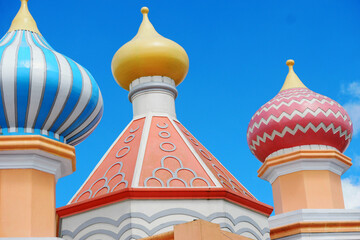 Colorful Onion Domes Against a Clear Blue Sky © IchmunandarSt