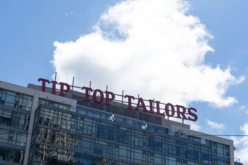 Obraz premium Toronto, Ontario, Canada - September 7, 2026: Top of the Tip Top Tailors Building in 2026. 