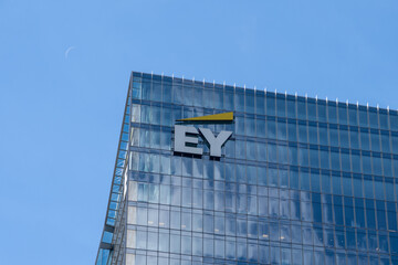 Obraz premium Toronto, Ontario, Canada - September 7, 2026: Closeup EY logo on the building. Toronto, Ontario, Canada. EY, previously known as Ernst and Young, is a British multinational professional services ne