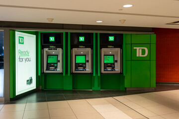 Obraz premium Toronto, Ontario, Canada - September 7, 2026: A row of indoor TD Bank ATM cash machines. Toronto, Ontario, Canada. 
