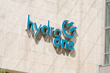 Obraz premium Toronto, Canada - September 7, 2026: Hydro One logo and signage on their headquarters building in Toronto, Ontario, Canada. Hydro One is Ontario’s largest electricity transmission and distribution ser