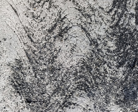 Distressed rough concrete wall texture background with black grunge abstract stains and cracks