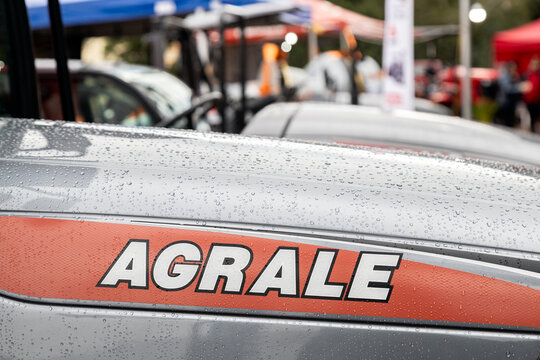 Caxias do Sul, Rio Grande do Sul, Brazil - Aug 8, 2026: Close-up of the Agrale logo on a rain-covered tractor hood