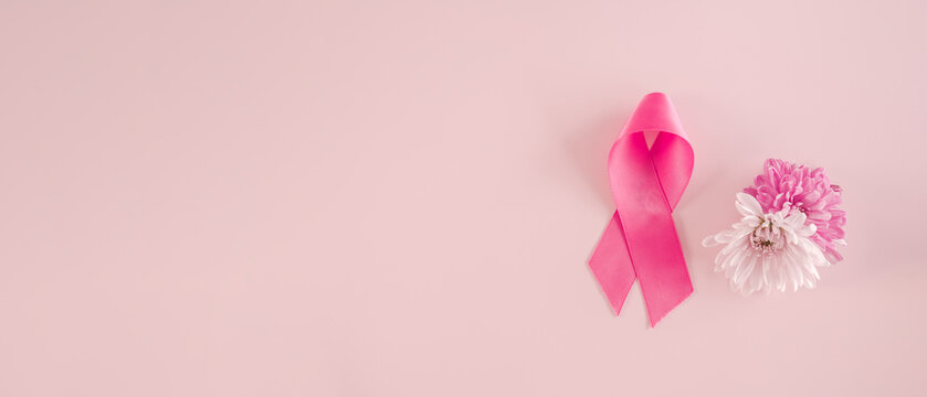Pink Ribbon and flowers with pink background, October pink, breast cancer awareness, world cancer day concept