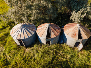 Three silos in the afternoon sunlight © Dana