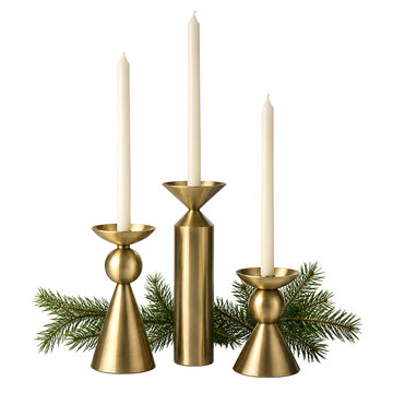 Three brass candlestick holders with lit white candles isolated. Christmas holiday