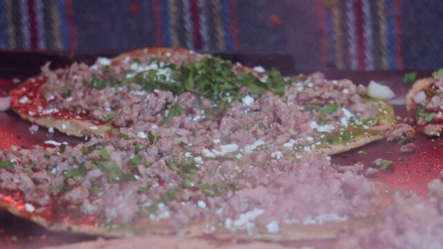 Delicious mexican memelas cooking on a hot comal