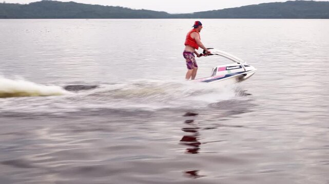 Stand up jet ski on a calm summer lake in the north on fresh water