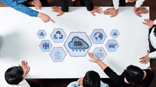 A diverse group of professionals collaborates around a table, focusing on carbon emission strategies. Infographics highlight various environmental concepts and sustainability icons. Raster