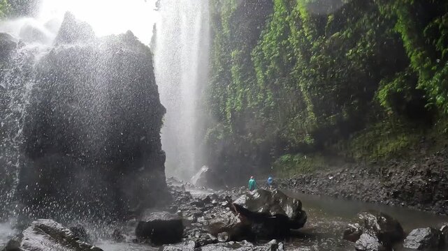 Footage of an environment and beautiful view of Madakaripura waterfalls the tallest waterfalls in Java island and second tallest waterfalls in Indonesia.