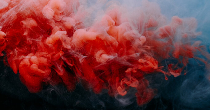 Paint vapor. Dye mist. Blur red blue color fume splash explosion smoke water droplets floating texture on abstract acrylic dark black art background.