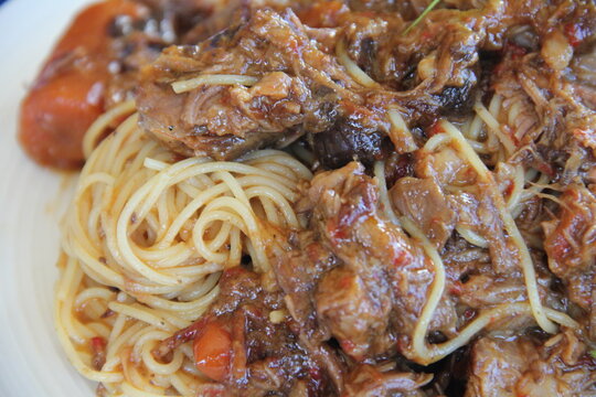Angel hair pasta with slow cooked beef short rib and pancetta ragout