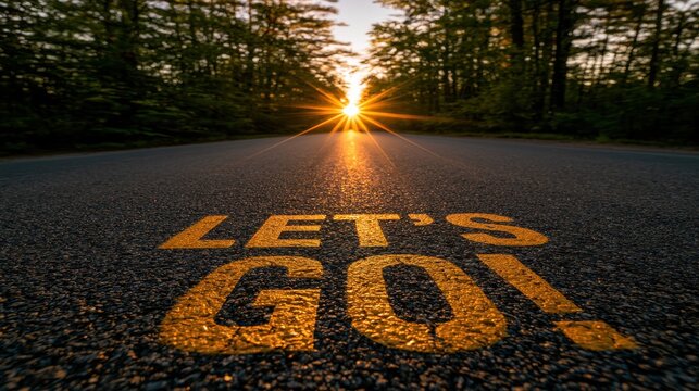 Low-angle road with Lets Go text in forest background, and sunrise flare, symbolizing travel, motivation, and new beginnings.