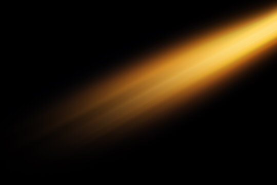 Abstract golden light streak on a dark background