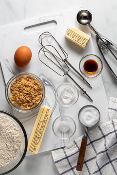 Various ingredients and tools used for making pie dough.