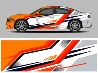 Fototapeta premium White car with dynamic orange and black racing stripes.