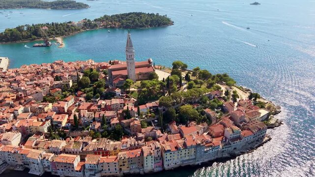 Aerial drone view of the red rooftops of the old town packed around the church of St Euphemia, Rovinj, Croatia