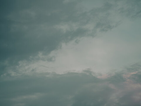 Minimalist Grey-Teal Storm Clouds Filling Expansive Moody Sky